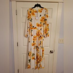 New sweet lined dress with cross tie waist.